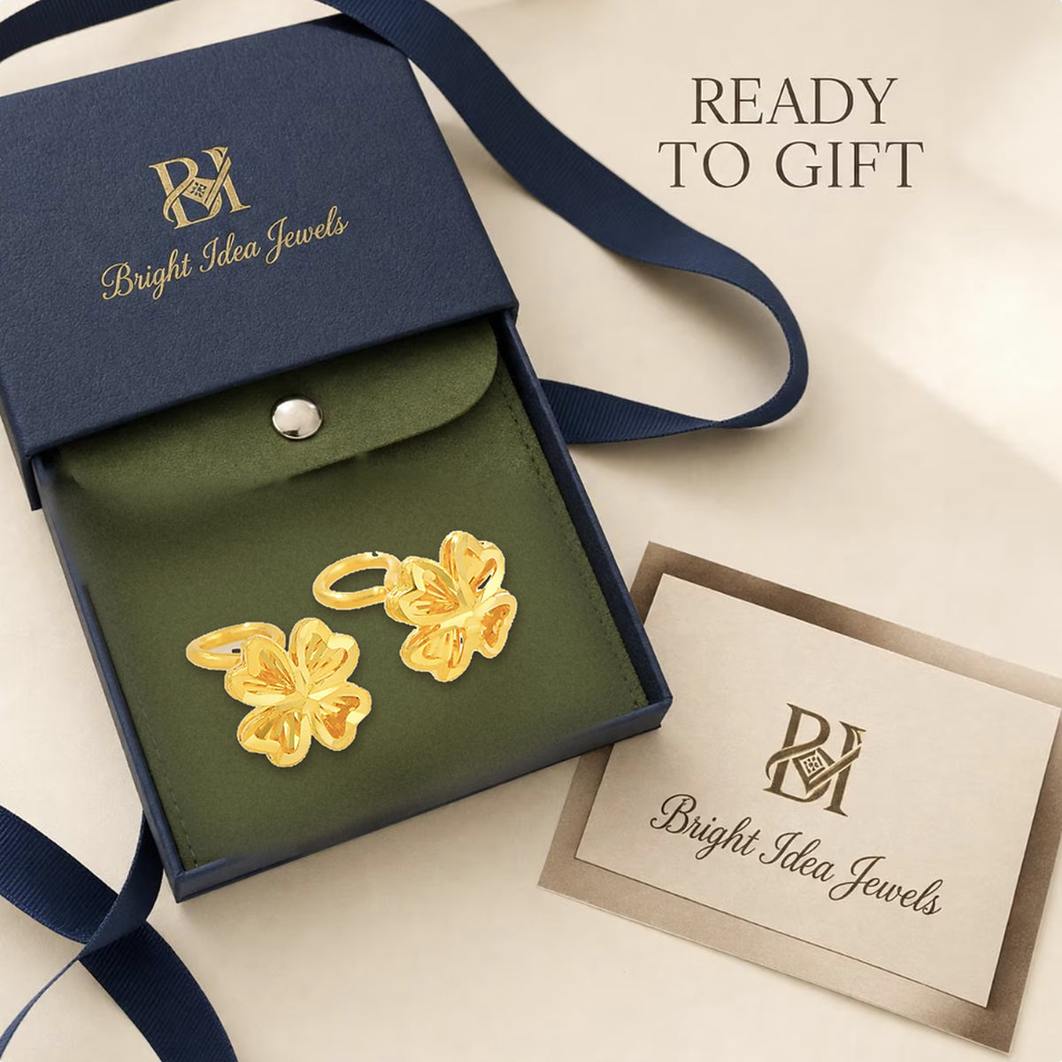 24K pure gold four-leaf clover earrings in Bright Idea Jewels gift packaging